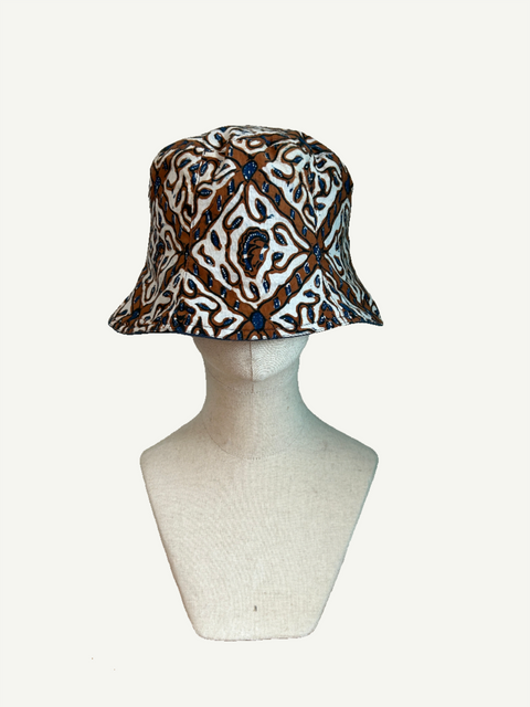 picture of a hat made from batik fabric on a head mannequin