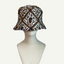 picture of a hat made from batik fabric on a head mannequin